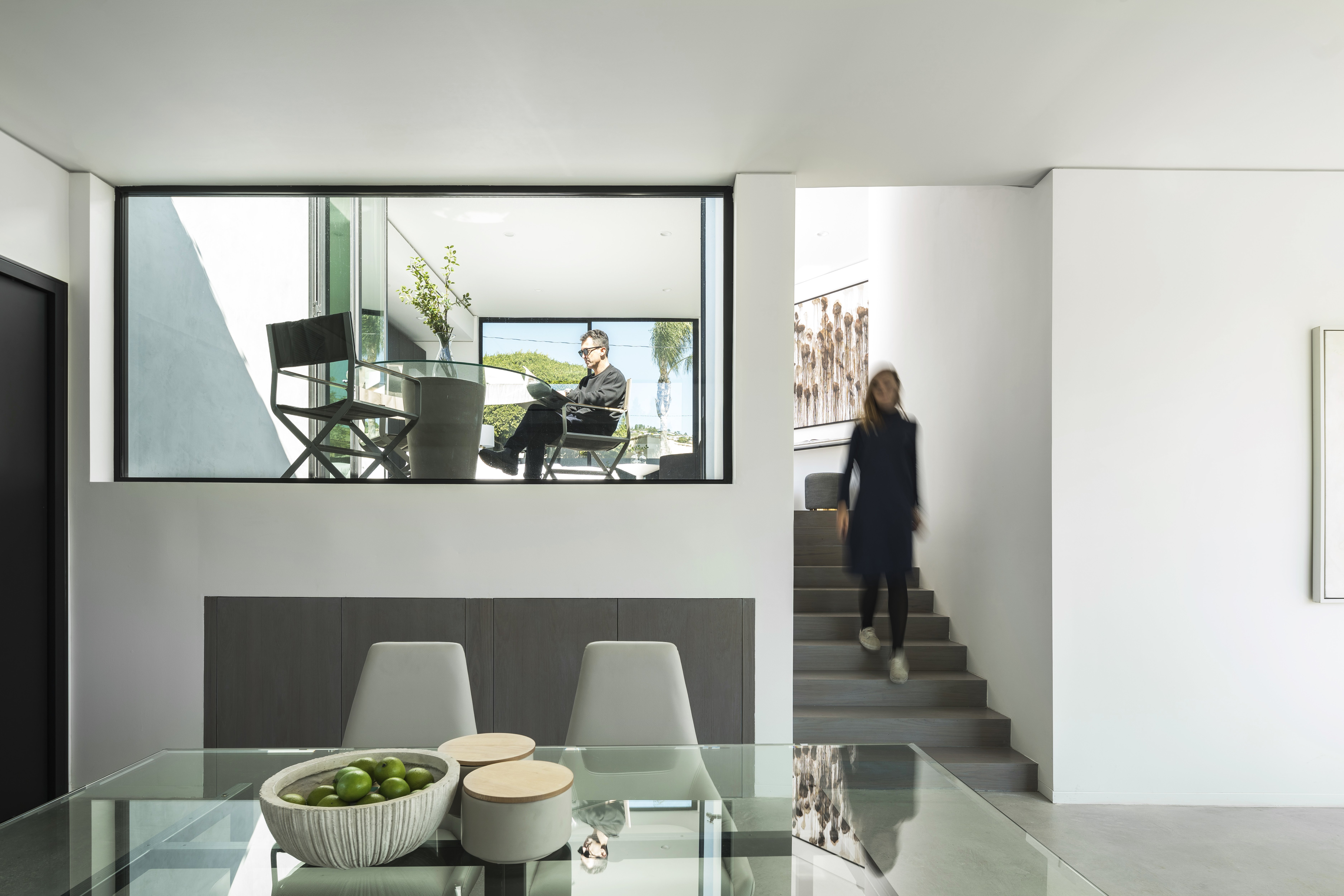 Hilldale residential exterior with a crisp contemporary facade and landscaped approach.