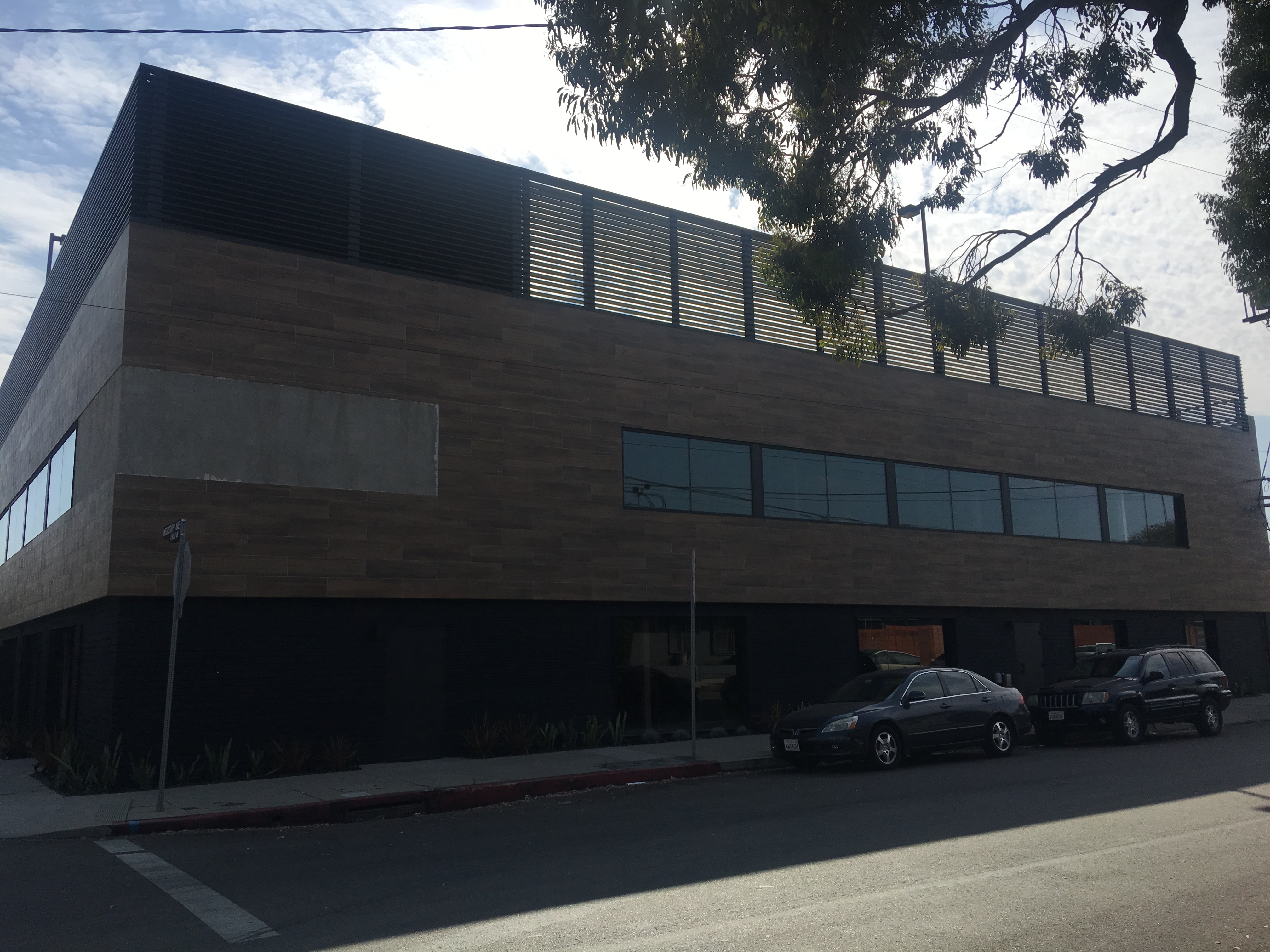 Mississippi Creative Offices interior with tall windows, exposed structure, and natural light across the workspace.